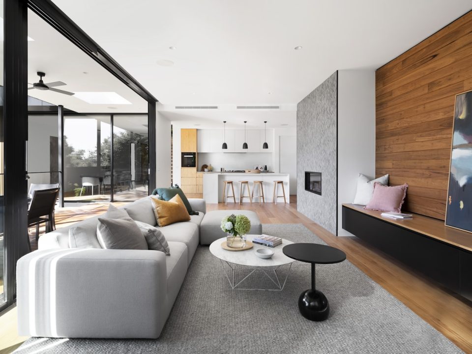 Warm residential interior with layered timber and stone finishes